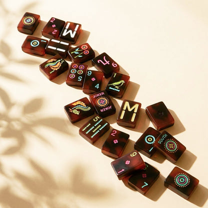 Loose diagonal run of neon tortoiseshell tiles in dappled sunlight