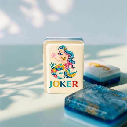 Macro of a mermaid Joker tile standing beside a marbled tile back
