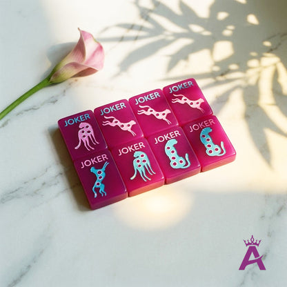 Magenta mahjong honor tiles with a rose, editorial negative space