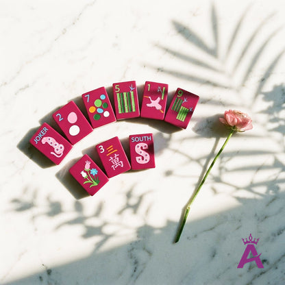 Fan of magenta crystal mahjong tiles with a flower
