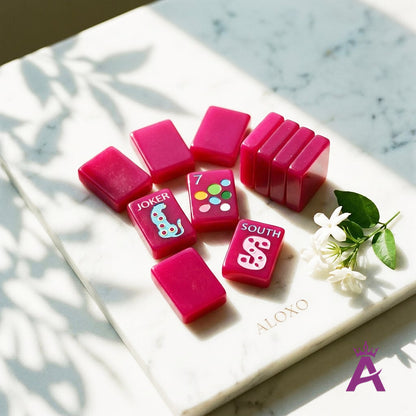 Magenta mahjong tiles grouped with sapphire leopard Jokers