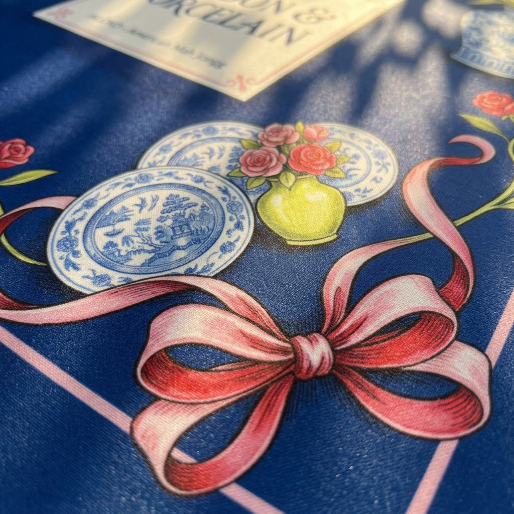 Close-up of the printed artwork on the Rose Ribbon & Porcelain mahjong mat