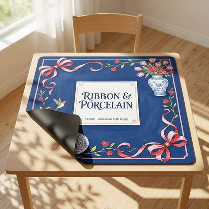 Rose Ribbon & Porcelain mahjong mat with one corner folded back to show the black rubber underside