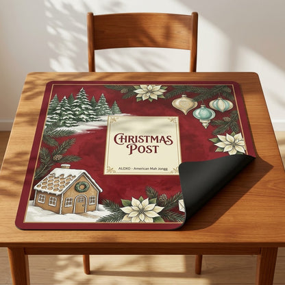 Snowy Christmas Post mahjong mat with one corner folded back to show the black rubber underside