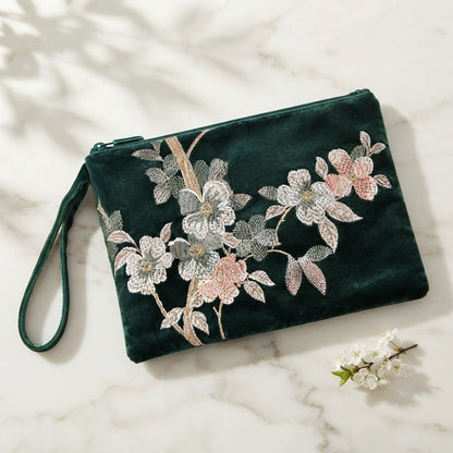 Green embroidered mahjong clutch with a matching wrist strap