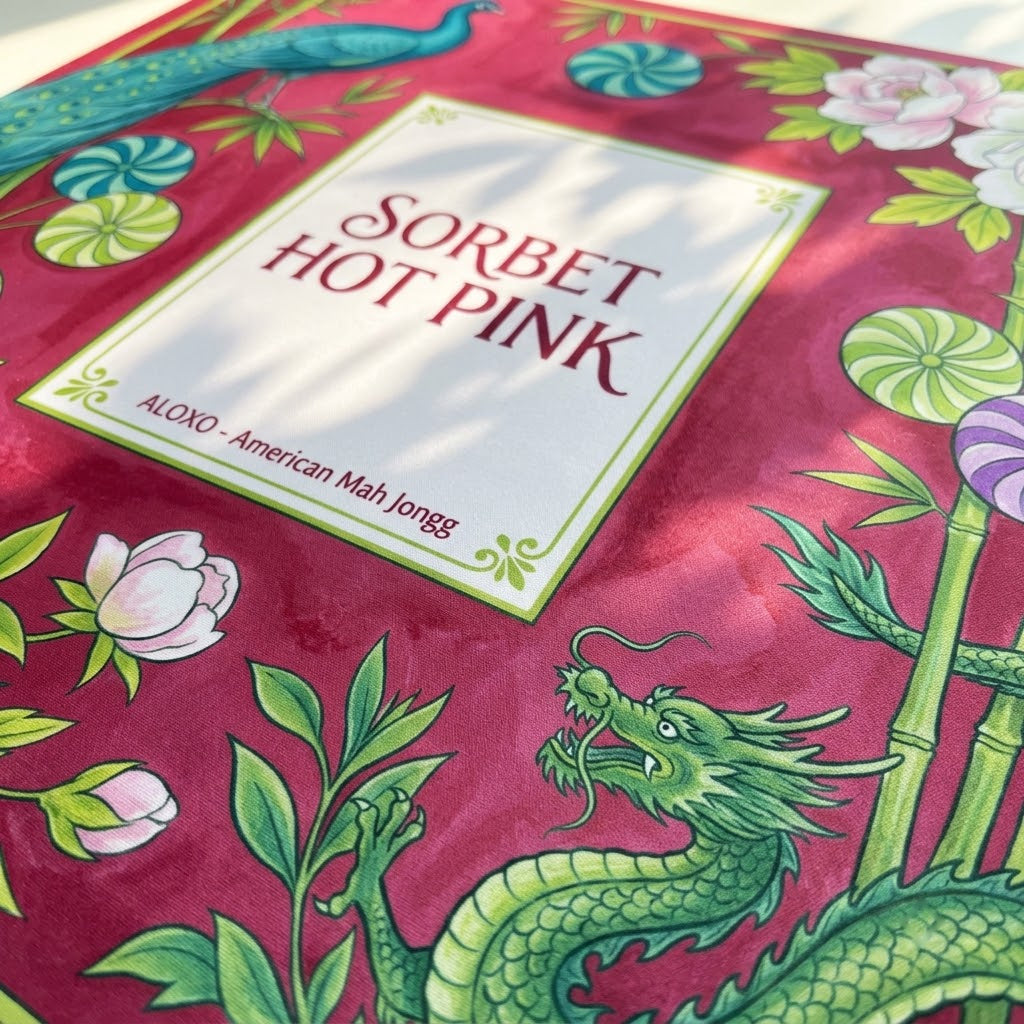 Close-up of the printed artwork on the Sorbet Pink Peacock mahjong mat