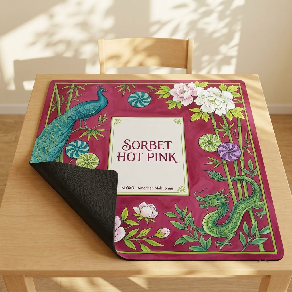 Sorbet Pink Peacock mahjong mat with one corner folded back to show the black rubber underside