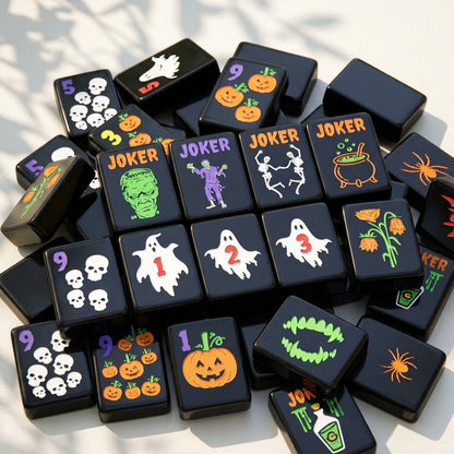 Close-up pile of black Halloween mahjong tiles