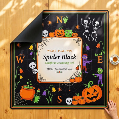 Spider Web Halloween mahjong mat with one corner folded back to show the black rubber underside