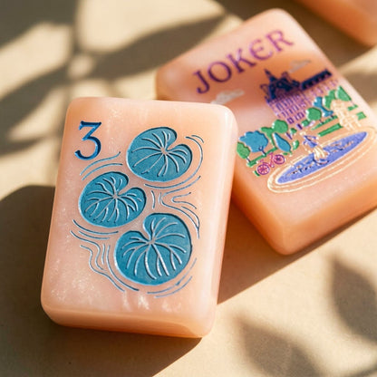 Macro of a water lily dot tile beside a Paris Joker tile