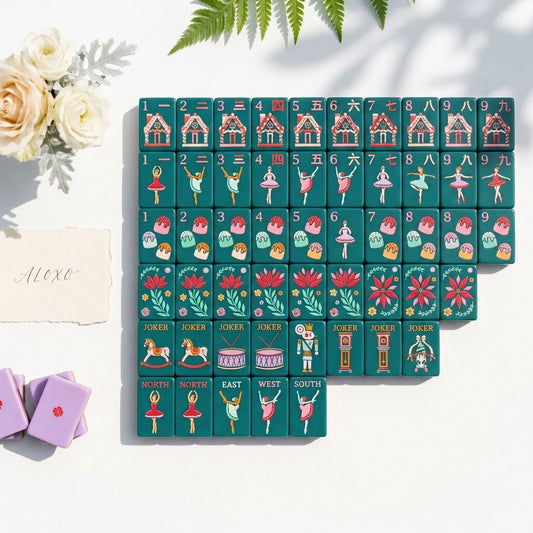 The full Sugarplum set laid out in a stepped block of forest-green tiles on bright white, with lilac-backed tiles stacked at the edge
