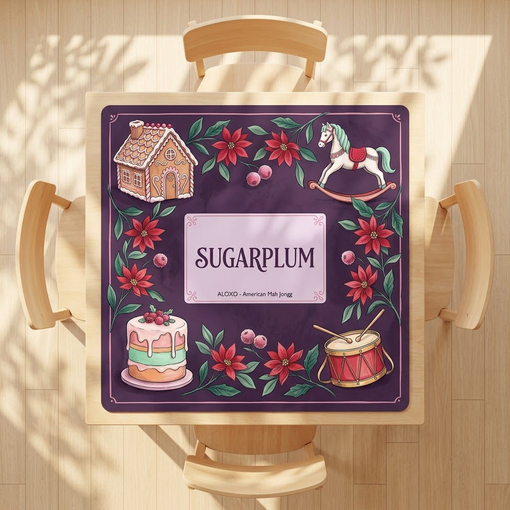 Sugarplum Sweet Shop mahjong mat on a square card table with four chairs, seen from above