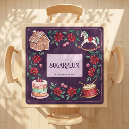 Sugarplum Sweet Shop mahjong mat on a square card table with four chairs, seen from above