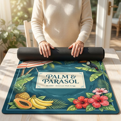 Woman unrolling the Tropical Palm & Parasol mahjong mat across a card table